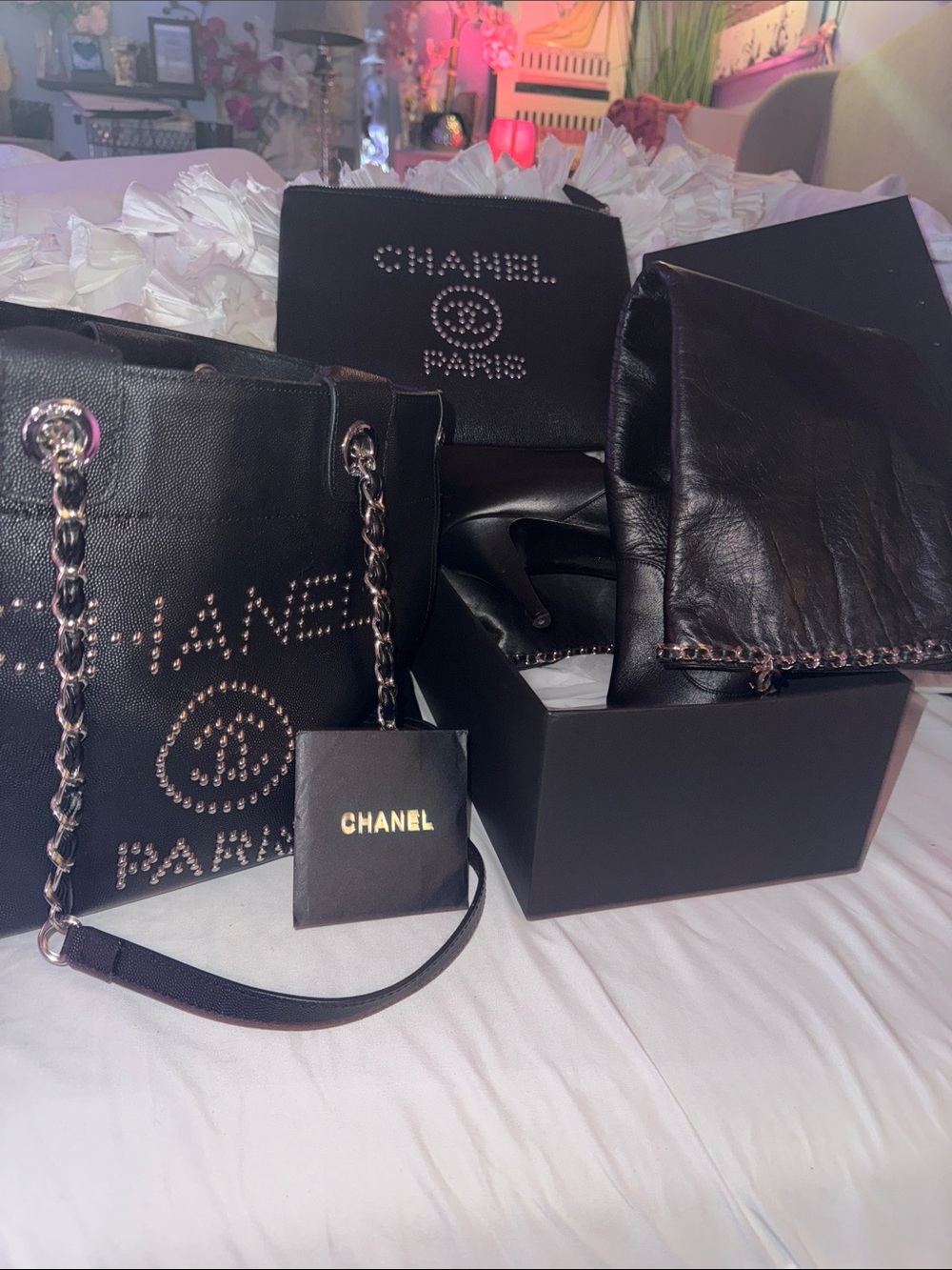 The whole black and silver set authentic Chanel boots, shopping tote, and clutch